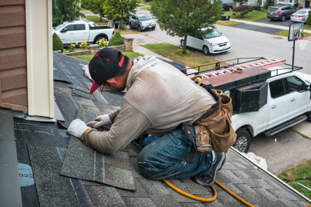 Professional Roofing technician working in New Century, KS